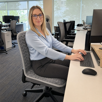 Woman working warm at her desk on Cozy Seat